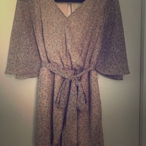 Blush pink floral romper with pockets and belt